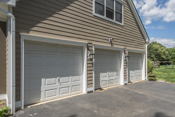 New siding installed around a home's triple garage.